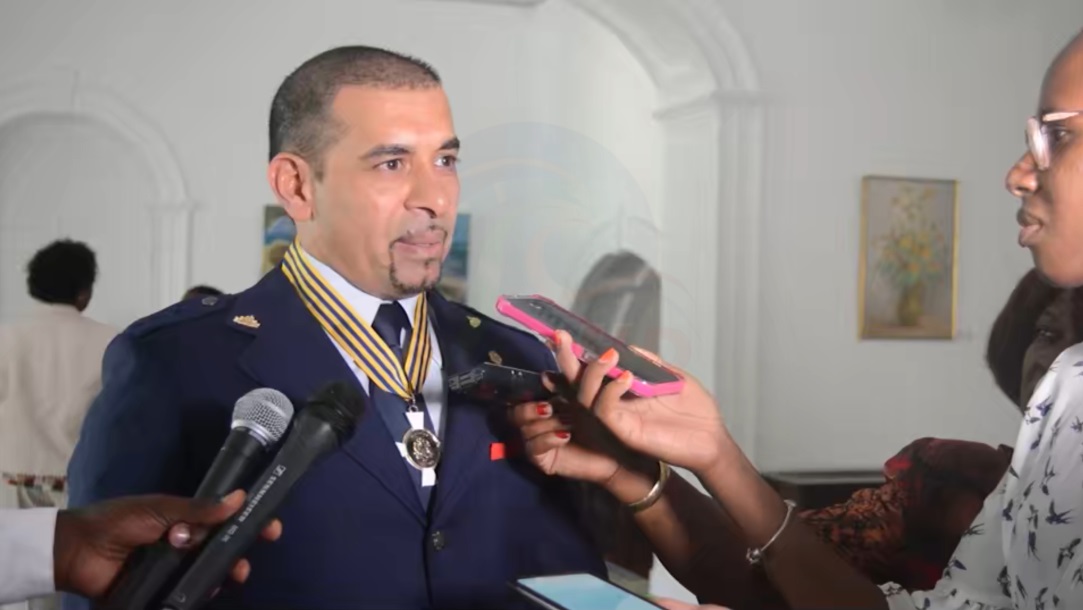 Gurdip Dev Bath speaking to reporters after receiving the Honorary Order of the Republic