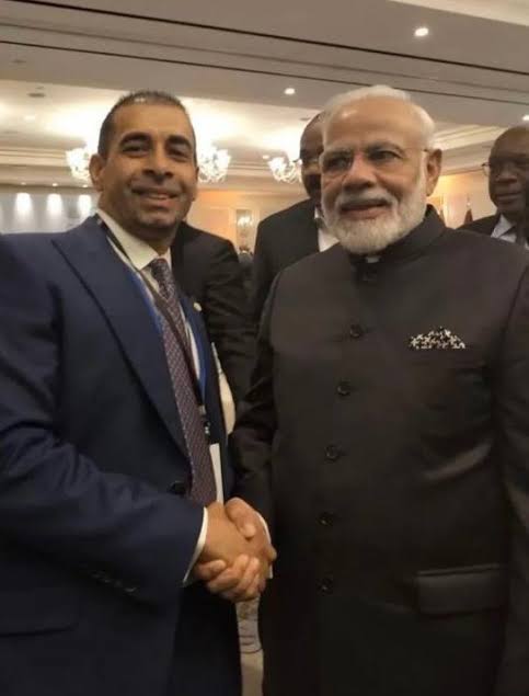 Gurdip Dev Bath shaking hands with Prime Minister Narendra Modi
