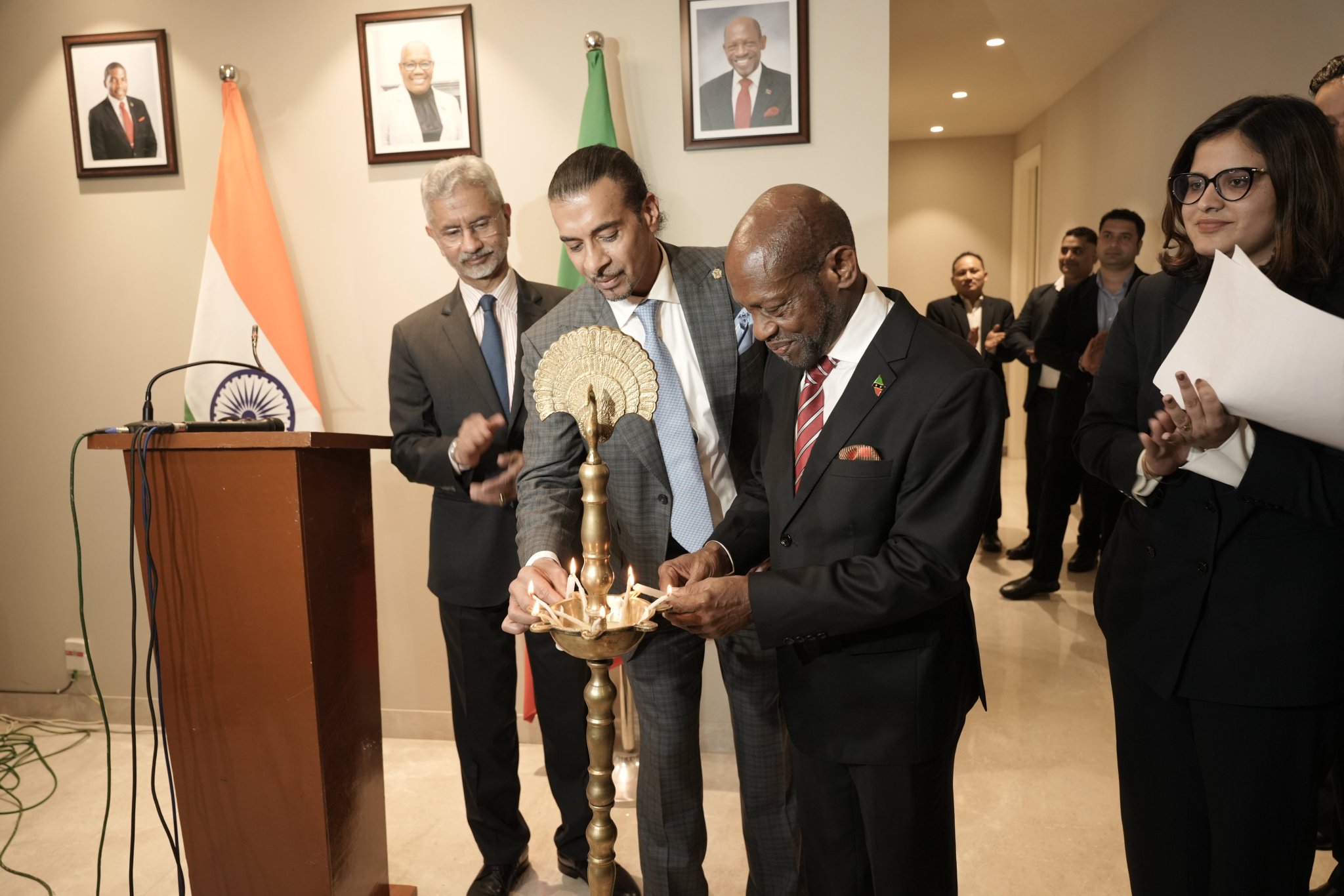 Gurdip Dev Bath and guests lighting a ceremonial lamp at the High Commission